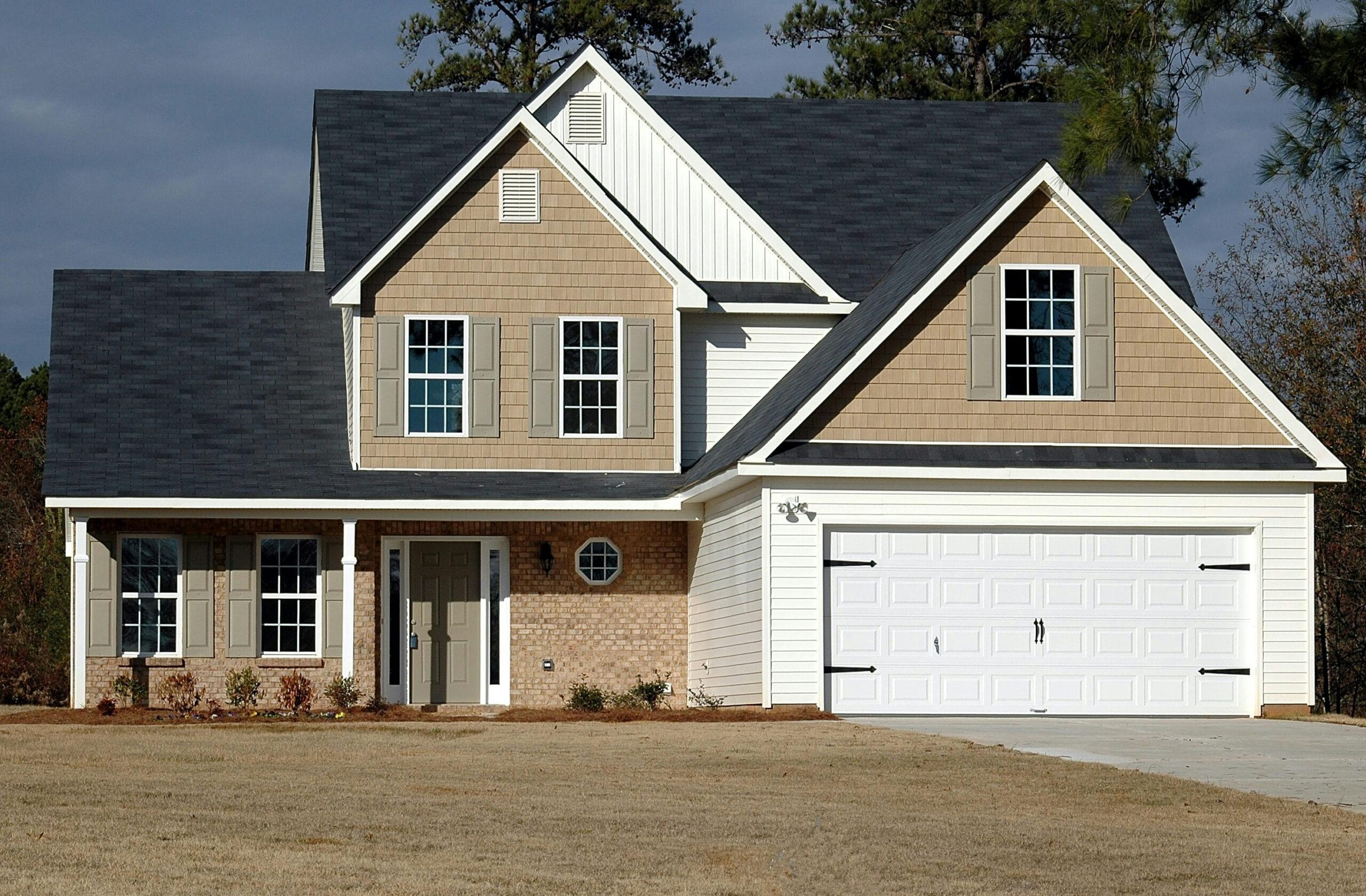 two storey home with white double garage