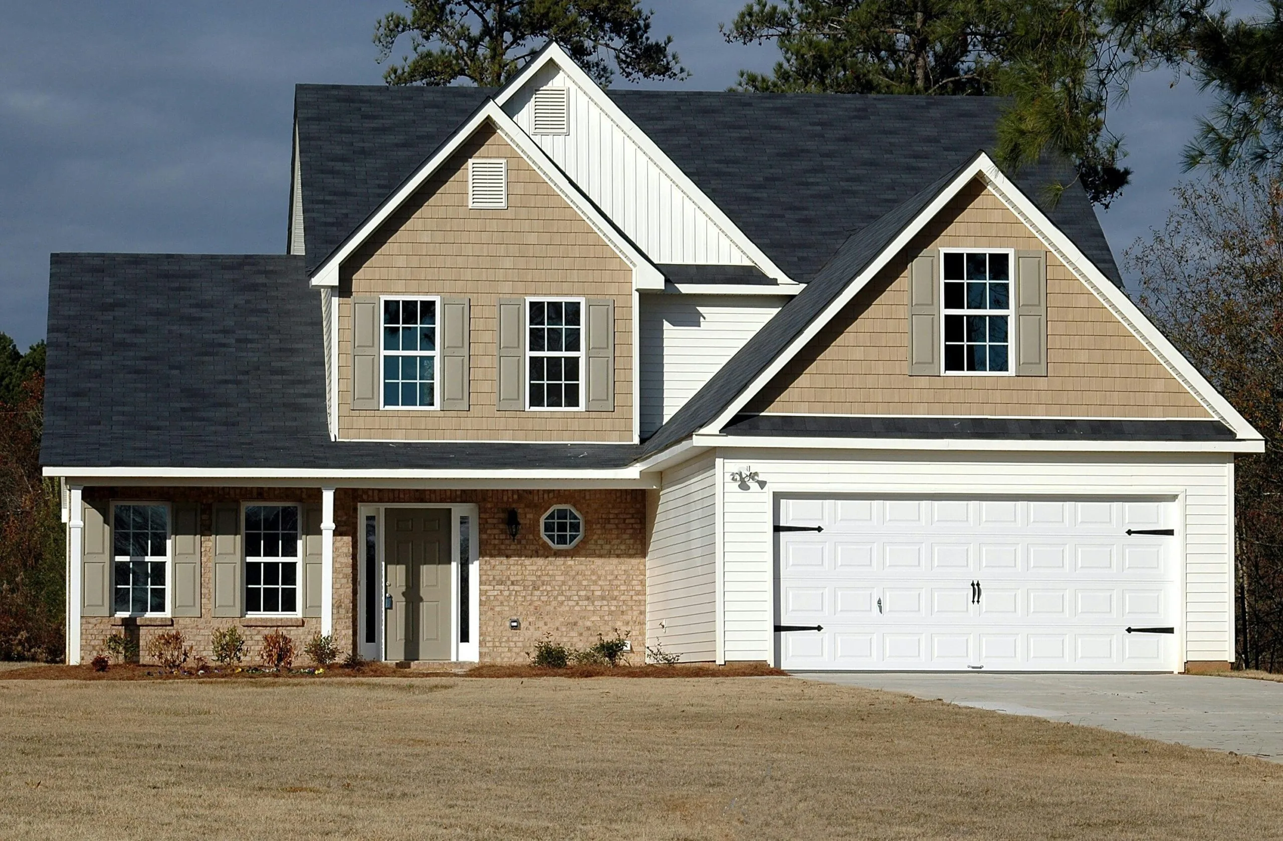 two storey home with white double garage